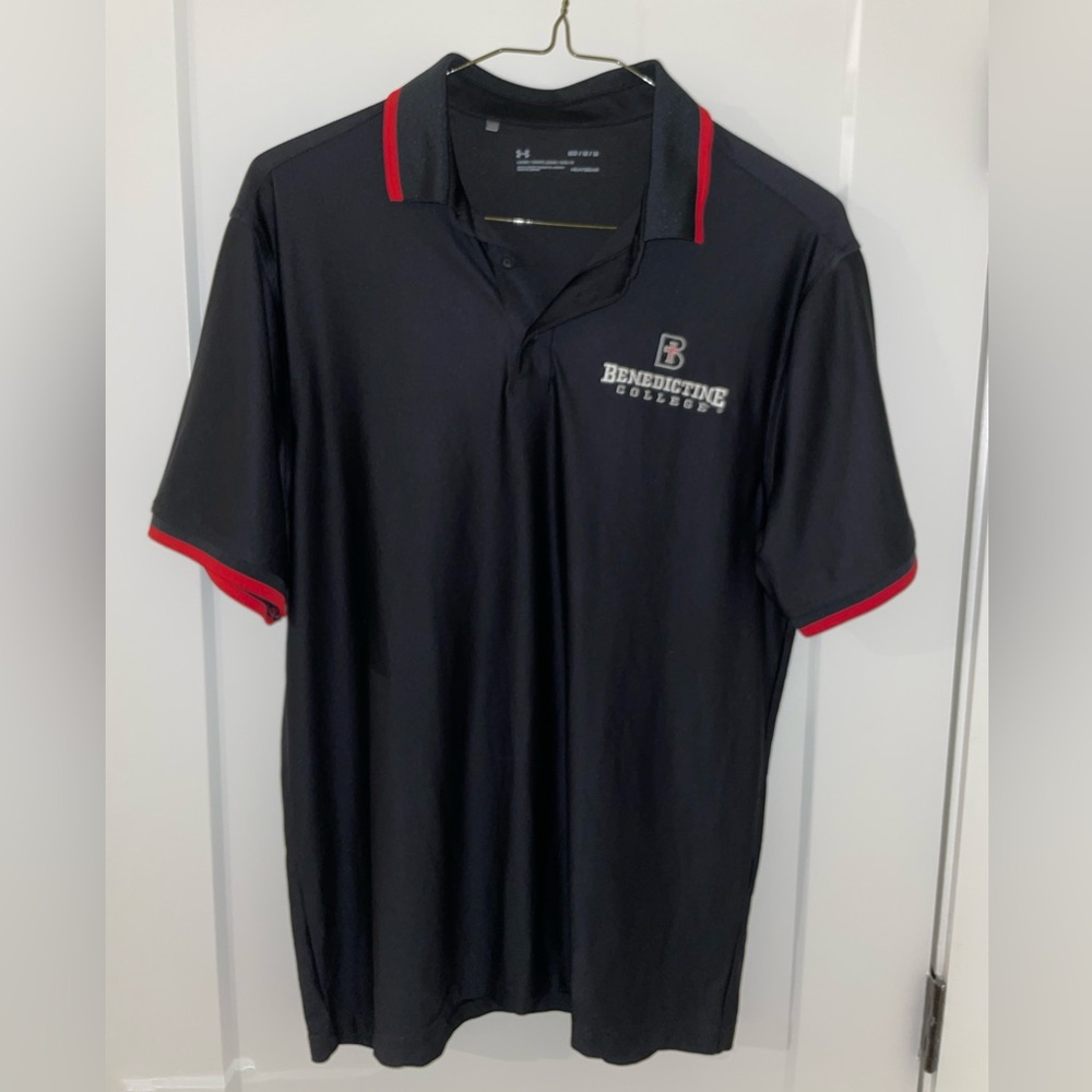 Black under Armour polo, Benedictine College branded in medium ￼
